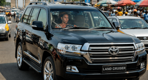 Toyota Land Cruiser driving on a busy road in Ghana representing defensive driving and road safety awareness training