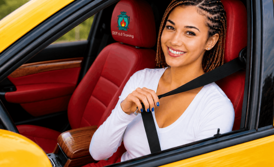 Woman wearing a seat belt while driving a car for road safety