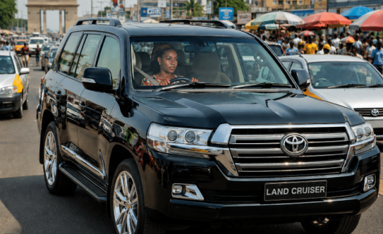 Toyota Land Cruiser driving on a busy road in Ghana representing defensive driving and road safety awareness training