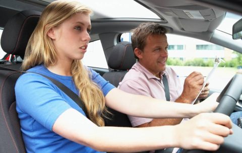 Teenage Girl Taking A Driving Lesson